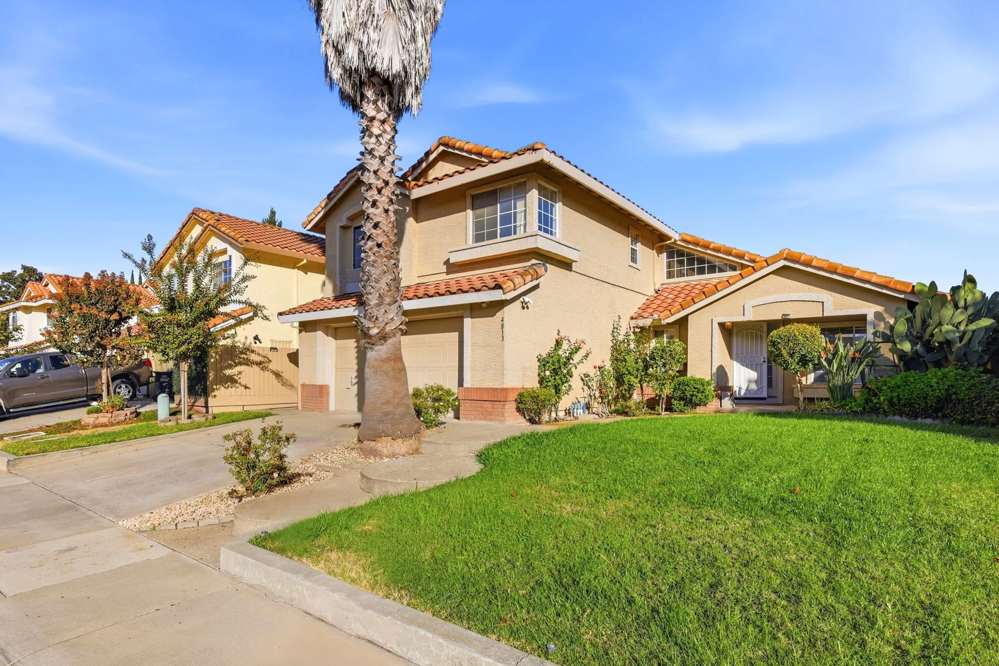 Front lawn, courtyard and full front exterior