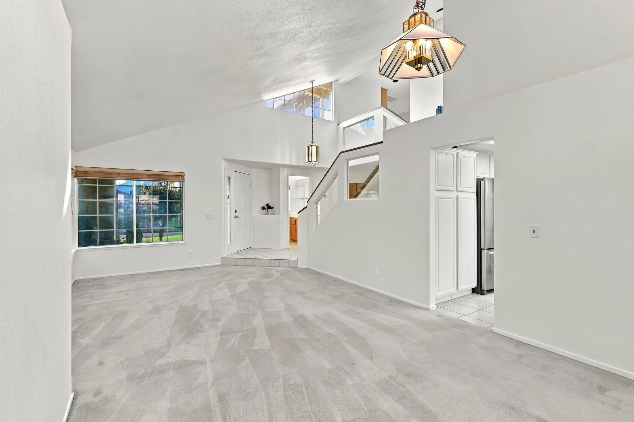 Living and dining rooms with vaulted ceiling